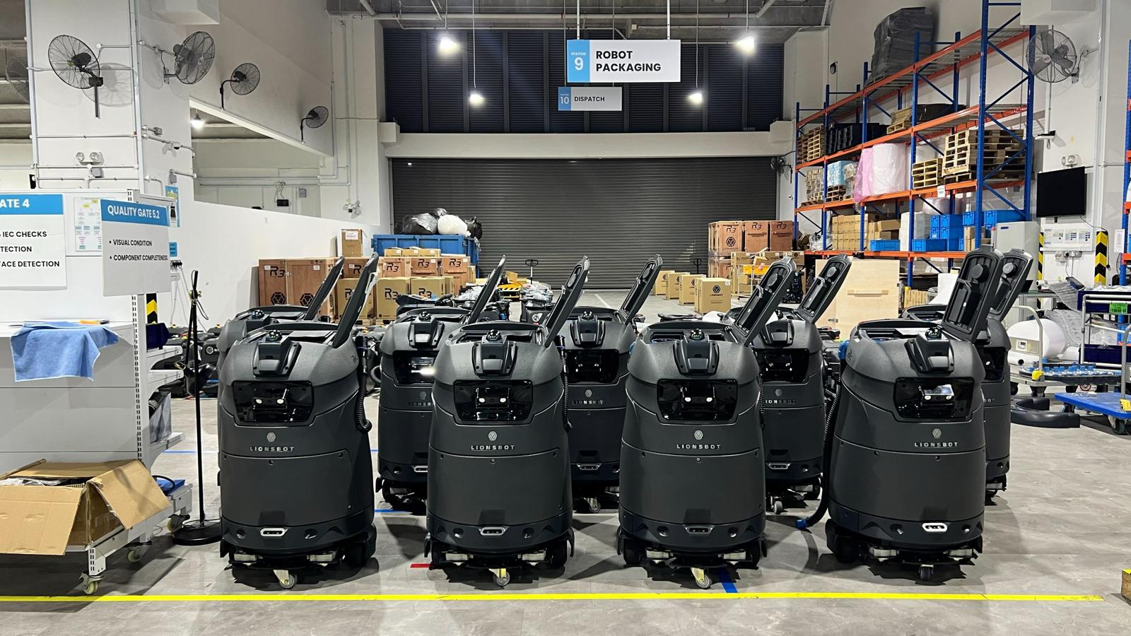 Completed robots lined up at the Lionsbot factory ahead of product launch